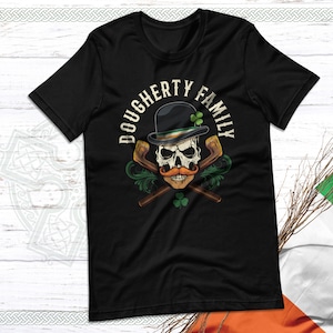 May include: Black t-shirt with a skull wearing a green and orange hat, a mustache, and crossed pipes. The text "DOUGHERTY FAMILY" is written around the skull.