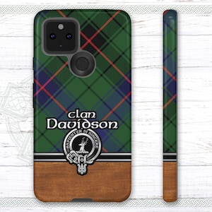 May include: A green, red, and blue plaid phone case with a wood-grain bottom. The case features the text "clan Davidson" and a crest with a stag and the words "Strenthter Sl Sincerere".