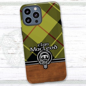 May include: A green, yellow, and red plaid phone case with a black and silver clan crest featuring a bull's head and the text "Clan MacLeod Hold Fast".