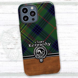May include: A green, blue, and yellow plaid phone case with the text "clan Kennedy" and a crest with the text "Consider the End". The case has a wood-grain pattern on the bottom.