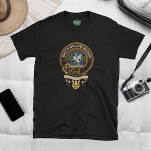 May include: Black t-shirt with a gold and brown crest featuring a lion and the text "Instaurautor Ruinae Forsyth".