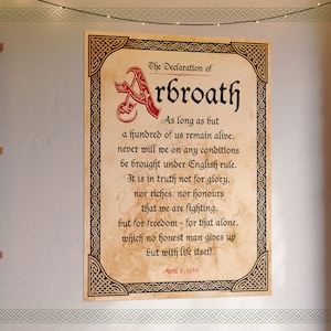 May include: A vintage-style parchment document with a Celtic knot border. The text reads "The Declaration of Arbroath" and includes a quote about freedom and fighting for it. The date "April 6, 1320" is at the bottom.