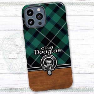May include: A green, black, and white plaid phone case with a silver crest and the text "Clan Douglas" in black. The crest has the text "Jamais Arriere" in silver.