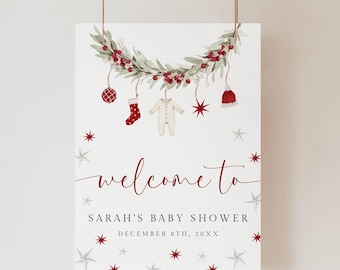 Può includere: Un cartello di benvenuto per baby shower bianco con una ghirlanda ad acquerello e ornamenti appesi. Il cartello recita "welcome to Sarah's Baby Shower" con la data sottostante. Accenti di stelle rosse e argentate completano il design.