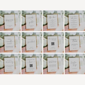 May include: A collection of gold-framed signs with various text, including "favors," "cards & gifts," "the bar," and "signature drinks." The signs are on a wooden surface, ideal for weddings or events.