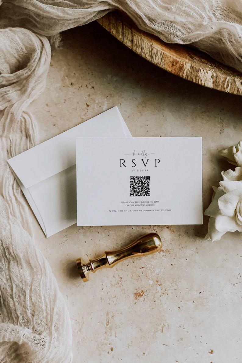 May include: A white RSVP card with a black QR code and the text "kindly RSVP by 2.25 XX" and "PLEASE SCAN THE QR CODE TO RSVP ON OUR WEDDING WEBSITE WWW.THIENOT/OURWEDDINGWEBSITE.COM".
