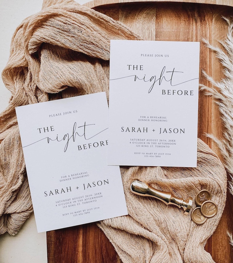 May include: Two white wedding rehearsal dinner invitations with black text, reading "The Night Before" and listing the date, time, and location. A gold wax seal stamp and wax seals are on a beige cloth.