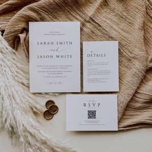 May include: Elegant wedding invitation suite featuring a main invitation, details card, and RSVP card. The main card displays the names "Sarah Smith and Jason White" with event details. Gold wax seals and pampas grass add decorative elements.