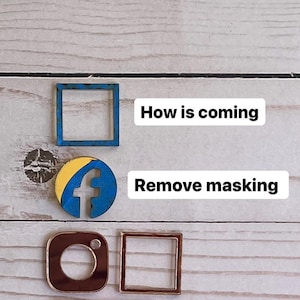 May include: Wooden social media icons, including a blue square, a Facebook logo, and an Instagram logo, are displayed on a light wood grain surface. The text "How is coming" and "Remove masking" are also present.