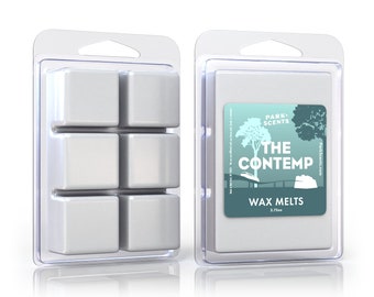 May include: A clear plastic container with six white wax melts. The container has a label that says "Park Scents" and "The Contemp Wax Melts 2.75oz".