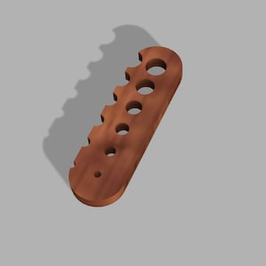 May include: A wooden tool with multiple round holes of varying sizes. The tool is brown and has a smooth, polished finish.