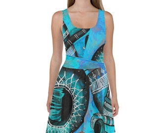 May include: A blue and black skater dress with a geometric pattern. The dress has a scoop neck and sleeveless design.