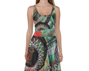 May include: A green, red, and black skater dress with a colorful abstract print featuring a stylized design of a musical instrument.