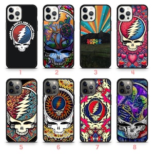 May include: A collection of eight phone cases featuring colorful skull designs. The cases showcase various artistic styles, including psychedelic art, Grateful Dead imagery, and vibrant patterns. Each case has a black border and a unique design.