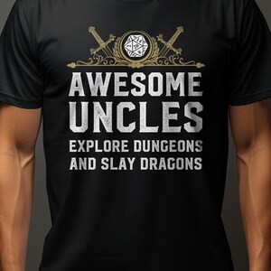 May include: Black t-shirt with a white graphic design featuring a stylized sword and dice with the text "Awesome Uncles Explore Dungeons and Slay Dragons".