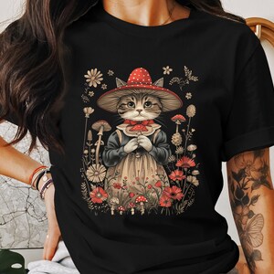 Cottagecore Cat T-Shirt, Whimsical Mushroom Cat Art Tee, Vintage Floral Cat Lover Shirt, Cute Feline in Red Hat Graphic Tee
