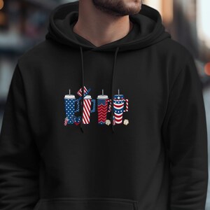 Black hoodie featuring four drinks decorated with American flag patterns and stars.