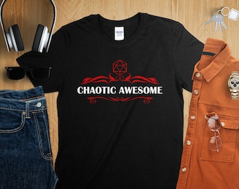 May include: Black t-shirt with a red and white design featuring a 20-sided die and the text "Chaotic Awesome".
