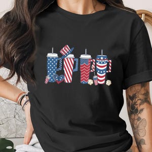 Four patriotic drinks with American flag designs and text.