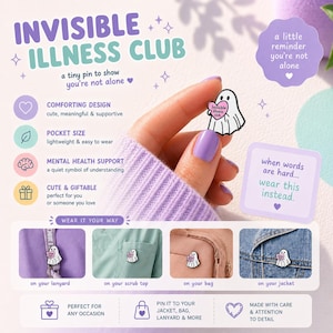 May include: A white ghost-shaped enamel pin with a pink heart that reads "Invisible Illness Club." The pin is shown on a lanyard, scrub top, bag, and jacket. The image includes text that says "a little reminder you're not alone" and "when words are hard... wear this instead."