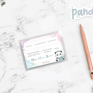 May include: A clear plastic sleeve containing a card with text and a panda illustration. A rose gold pen, three rose gold binder clips, and a sprig of greenery are on a white marble surface. The card has the text "Need Have Supply".