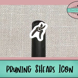 May include: A white sticker with a black silhouette of pruning shears on a black background. The sticker is on a black roll of sticker paper. The text "PRUNING SHEARS ICON" is at the bottom of the image.