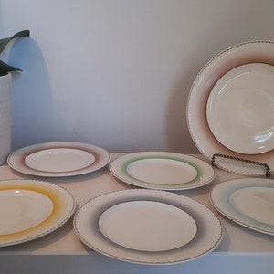 Multi-coloured Portland Pottery Cobridge Staffordshire Plate set.
