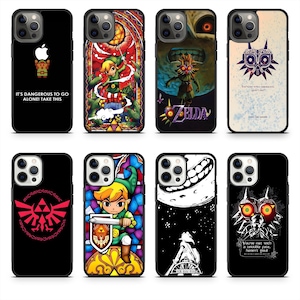 May include: A collection of black phone cases featuring various designs. Some cases display video game-themed graphics, including characters and logos from the Zelda series. One case has the text "IT'S DANGEROUS TO GO ALONE! TAKE THIS".