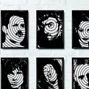 May include: A white brick wall with 12 black framed portraits of people. Each portrait is a black and white image of a person's face with a circular pattern of lines over the face.