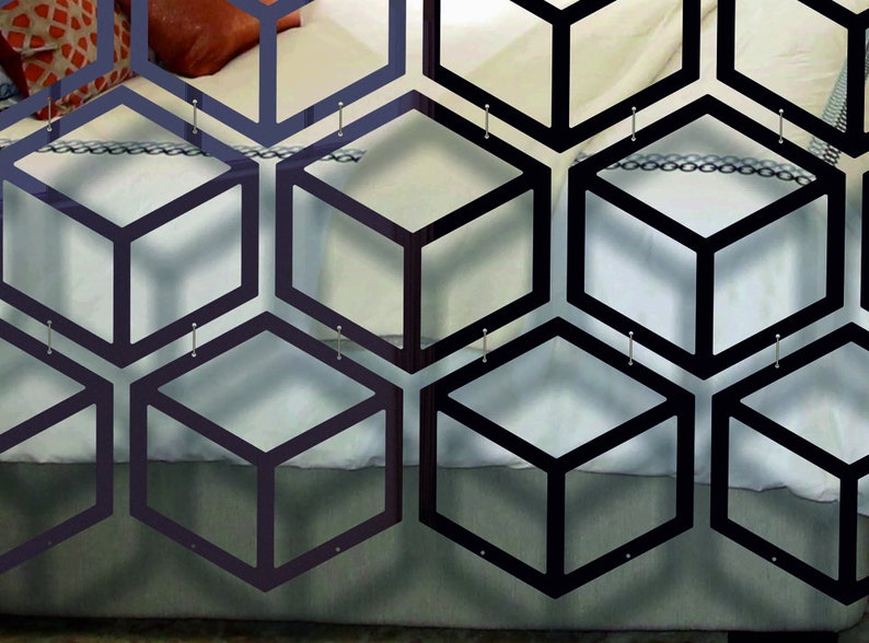May include: Black geometric room divider made of multiple connected hexagonal shapes with a 3D cube design. The divider is hanging on a wall and is made of a thin, lightweight material.