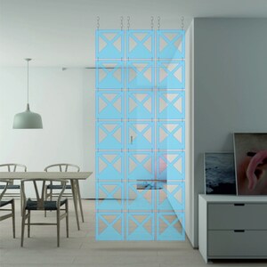 May include: A light blue room divider made of interlocking panels with a geometric design. The divider is hanging from the ceiling and is made of thin, lightweight material.