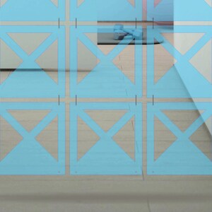 May include: A light blue room divider with a geometric pattern of overlapping triangles. The divider is made of thin, translucent panels that are hung from the ceiling.