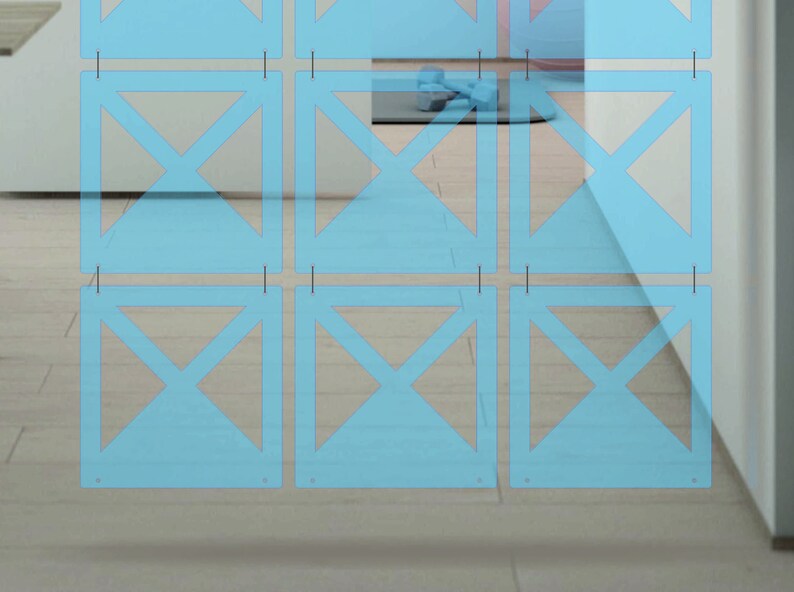 May include: A light blue room divider with a geometric pattern of overlapping triangles. The divider is made of thin, translucent panels that are hung from the ceiling.