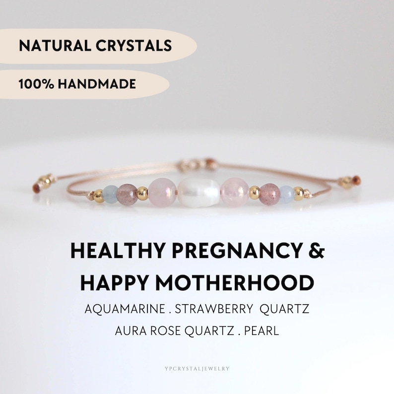 May include: A beaded bracelet featuring a central white pearl flanked by pink rose quartz, strawberry quartz, and light blue aquamarine beads, accented with small gold-tone metal spheres on a thin cord. Text reads: NATURAL CRYSTALS 100% HANDMADE HEALTHY PREGNANCY & HAPPY MOTHERHOOD AQUAMARINE . STRAWBERRY QUARTZ AURA ROSE QUARTZ . PEARL YPCRYSTALJEWELRY