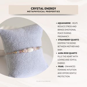 May include: A delicate bracelet featuring a central white pearl flanked by pink strawberry quartz, light blue aquamarine, and small gold-tone beads on a thin cord. Text on the image reads: CRYSTAL ENERGY METAPHYSICAL PROPERTIES, AQUAMARINE, STRAWBERRY QUARTZ, AURA ROSE QUARTZ, PEARL, and YPCRYSTALJEWELRY.