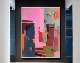 May include: Abstract painting with bold strokes of pink, red, orange, yellow, green, and blue. The painting is framed and hanging on a wall in a hallway.