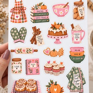 May include: A sticker sheet titled AUTUMN SOUL BAKING DAY featuring illustrations of an apron, stacked books, a mixing bowl, a jar of cookies, oven mitts, cinnamon sticks, a cake, a mug, a rolling pin, cookies, bowls, flour, a recipe book, cupcakes, cinnamon rolls, a pumpkin, and a towel.