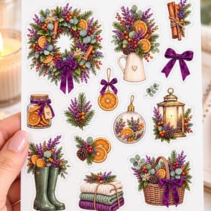 May include: A sticker sheet titled AUTUMN SOUL WOODLAND GATHERINGS featuring illustrations of a wreath, a pitcher with flowers, cinnamon sticks, a purple bow, a jar of orange slices, a lantern, rain boots, folded blankets, and a basket.