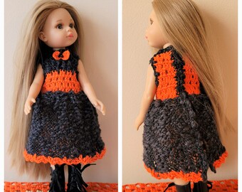 May include: A doll wearing a black and orange crocheted dress with a bow. The doll has long blonde hair and is wearing black boots.