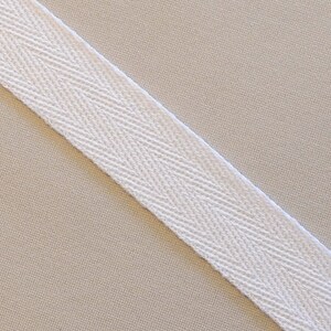 May include: White cotton twill tape with a herringbone pattern.