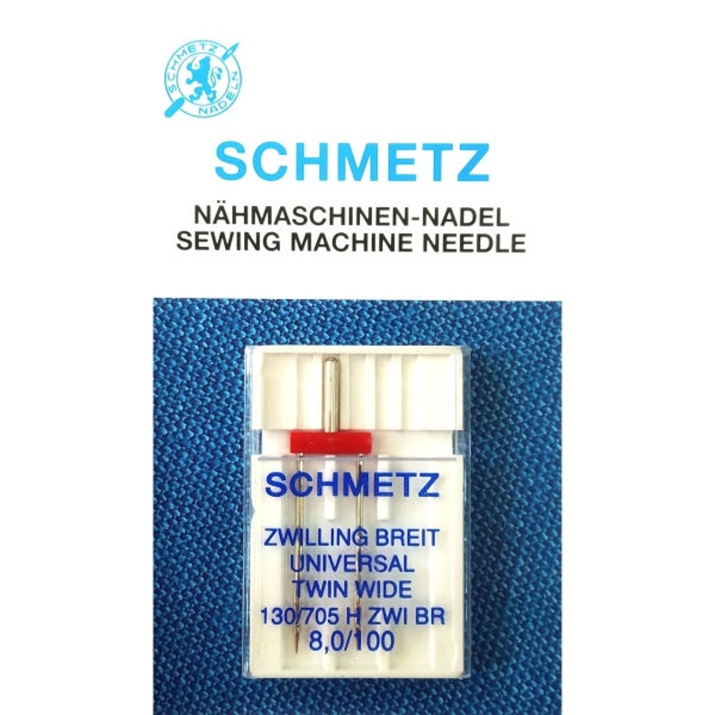 Pode incluir: Um pacote com duas agulhas para m&aacute;quina de costura Schmetz, com a etiqueta "Zwillling Breit Universal Twin Wide 130/705 H Zwi BR 8,0/100".