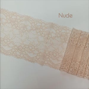 May include: Nude lace trim with a floral pattern. The lace is delicate and has a soft, feminine feel.