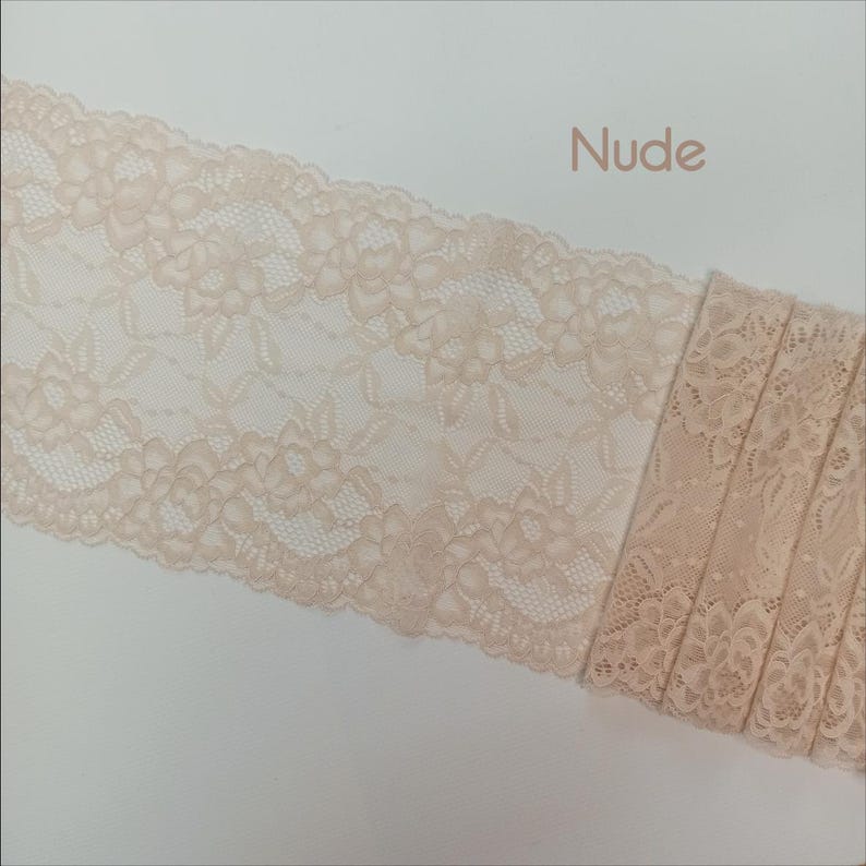 May include: Nude lace trim with a floral pattern. The lace is delicate and has a soft, feminine feel.