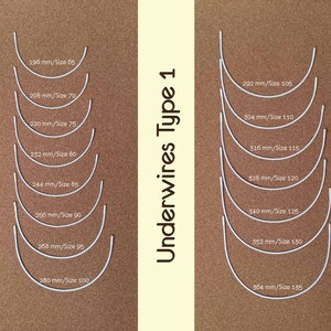 May include: A collection of white underwires, Type 1, in various sizes, arranged on a brown background. Sizes range from 196 mm/Size 65 to 364 mm/Size 135. The text "Underwires Type 1" is displayed vertically.