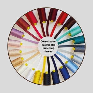 May include: A color wheel of spools of thread and ribbon for corset boning and casing. The text "Corset bone casing and matching thread" is in the center of the wheel.