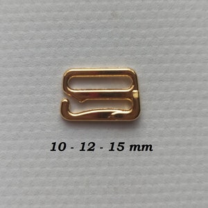May include: Gold metal slider buckle with three loops. The buckle measures 10 - 12 - 15 mm.