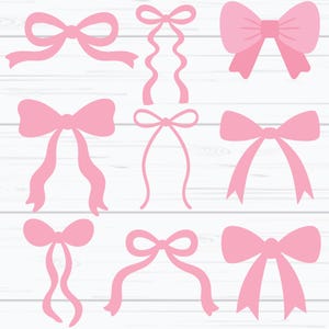 May include: Nine pink ribbon bows in different styles, set against a white wooden backdrop. The bows vary in design, some with long, flowing tails and others with more compact shapes. Ideal for crafting or gift wrapping.