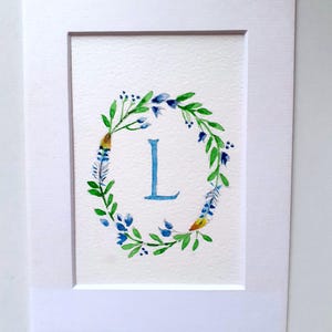 Cartolina acquerellata con l'iniziale L