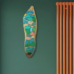 May include: A wooden wall clock with a natural edge, painted with a colorful landscape design. The clock face features gold-colored hands and is mounted on a teal wall. The clock's dimensions are approximately 24 inches in height.