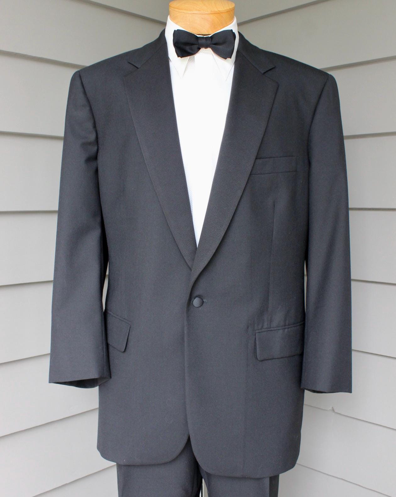 Southwick, vintage -Southwick- Men's 2 piece Tuxedo. Black grosgrain on Black worsted. Single breasted w/ pleat front pant. US Size 44 Tall x 36". USA